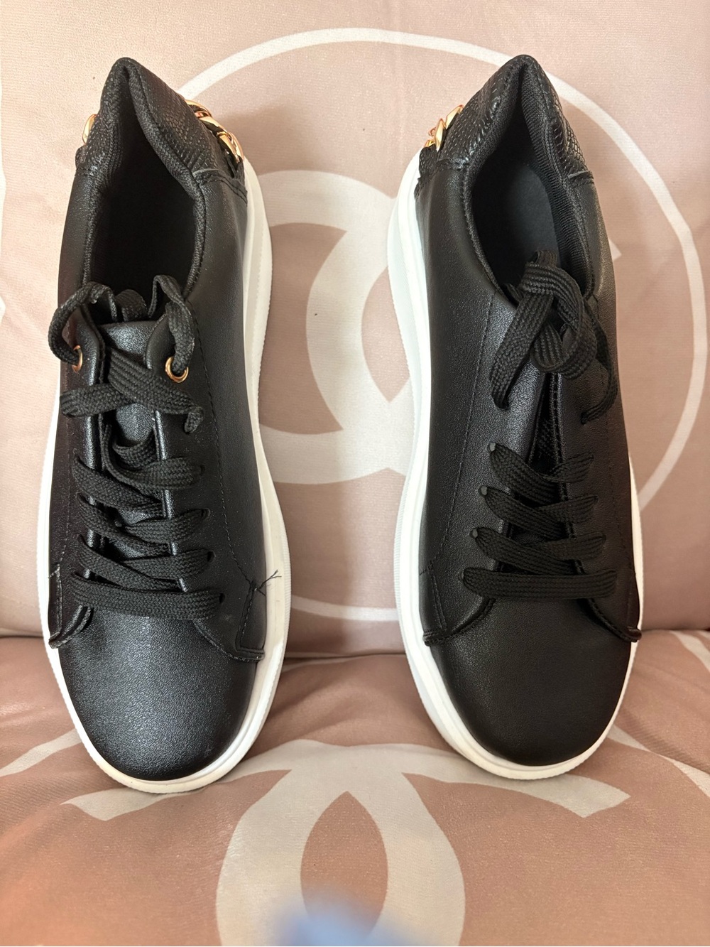 Women's Black Low-Top Sneakers with White Sole and Subtle Gold Accent